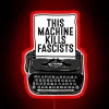 Vintage typewriter-inspired neon sign with bold, edgy "This Machine" phrase.