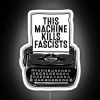 Black typewriter-inspired RGB neon sign with vintage anti-fascist typographic design.