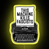 Vintage typewriter-inspired black and red neon LED sign decoration.
