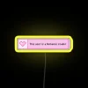 Romantic Reading Ambiance: Pastel Pink Neon Sign with Heartbeat Effect
