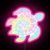 Vibrant tie dye turtle design in colorful multicolor RGB lighting