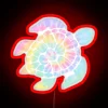 Vibrant tie-dye turtle shines brightly in radiant, electric glow