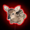 Whimsical woodland wonder: Tiny Deer neon sign in RGB colors.