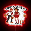 Glowing Halloween decoration featuring colorful Trick-or-Treat neon lettering illuminates space