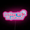 Vibrant RGB lighting illuminates the phrase 'TWICE Trying To Let You Know'