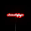 Classic European city charm in vibrant RGB neon signage accents.