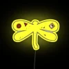 Vintage psychedelic dragonfly LED neon sign with colorful glowing accents