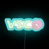 Eye-catching VSCO inspired Srunchies logo in vibrant RGB neon lighting