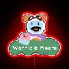 Neon sign featuring waffle and mochi in vibrant color gradient.