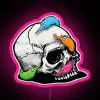 Vibrant worms on a string adorn a colorful skull sign