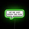 RGB neon sign displaying 'Let me just finish this row' in vibrant green.