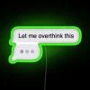 neon sign displaying 'let me overthink this iphone text message' in green.