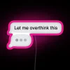 Neon iPhone text message sign displaying 'Let me overthink this' in vibrant RGB pink colors.