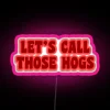 Let's Call Those Hogs Neon Sign with a vibrant RGB neon pink glow - perfect for gaming, esports, or entertainment content.