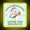 RGB neon sign displaying 'Let's circle back after the holidays' in a vibrant yellow glow.
