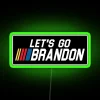 Vibrant neon 'Let's Go Brandon' sign with RGB lighting effects in green.
