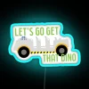 Vibrant RGB neon sign spelling 'Let's Go Get That Dino' - perfect for a dinosaur-themed adventure!