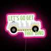 Let's Go Get That Dino neon sign with pink RGB lighting - perfect for theme park or event attraction.
