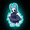 The alt text for the image is: 'neon blue little ghost sign'.