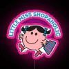 Neon RGB sign displaying 'Little Miss Shopaholic' in vibrant pink colors.