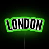 Curved London RGB neon sign with green lighting.