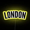 curved neon sign displaying vibrant rgb lighting with a yellow glow in london