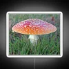 vibrant rgb neon sign featuring a solitary fly agaric mushroom