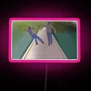 Neon Sign Displaying Luke And Jess In RGB Colours With Pink Tone.