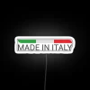 neon sign displaying made in italy with italian flag rgb neon on white