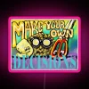 neon sign displaying make your own decisions in rgb colors with pink glow