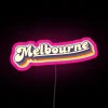 Melbourne VIC retro neon sign featuring vibrant rainbow RGB colors and a pink glow.