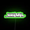 'Mentally at the Book Fair neon sign with green RGB lighting.'