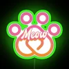 A vibrant neon sign spelling MEOW in RGB colors, perfect for cat lovers.