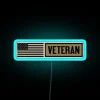 Neon sign displaying 'MILITARY VETERAN' in vibrant RGB colors with a blue tone.