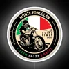 Monte Zoncolan Italy motorcycle under vibrant RGB neon sign in white.