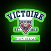 Vintage Montreal Victoire PWHL logo neon sign in green.