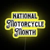 A vibrant RGB neon sign displaying 'Motorcycle Gifts' in celebration of National Motorcycle Month.