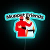 A neon sign displaying 'Muppet Friends' in vibrant RGB colors.
