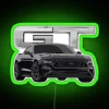 A sleek Ford Mustang GT V8 in Shadow Black with RGB neon lighting and green accents.