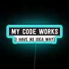 RGB neon sign displaying 'My Code Works! I Have No Idea Why' in blue.