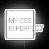 neon sign displaying 'my css is perfect' in rgb colors with a white glow.