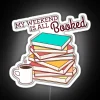 rgb neon sign displaying my weekend is all booked in vibrant colors.