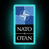 nato-otan-military-defense-alliance-europe-usa-neon-sign-blue.webp