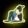 nerdy gorilla guy with an rgb neon yellow sign