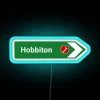 neon road sign displaying vibrant rgb lighting near hobbiton in new zealand