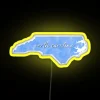 North Carolina tie-dye neon sign with RGB and yellow highlights.
