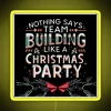 An office Christmas party with a vibrant RGB neon sign, yellow illuminated, team building event.