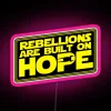 rgb pink neon sign artwork featuring rebellions and hope