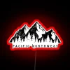 pacific-northwest-mountain-range-with-pine-trees-and-a-glowing-red-neon-sign