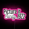 Neon sign spelling Picture It Sicily in vibrant pink tones with a retro vibe.